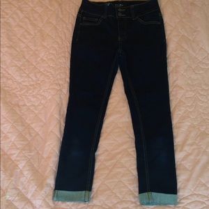 Dark wash rolled up jeans. High waisted